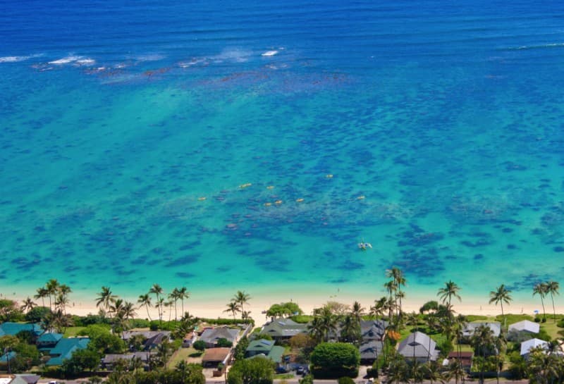 lanikia beach from above with kayaks