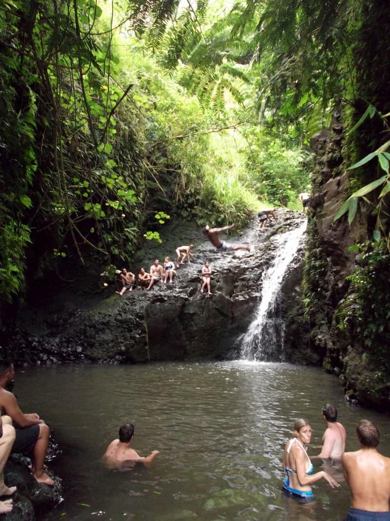 people swimming at the Maunawili Falls