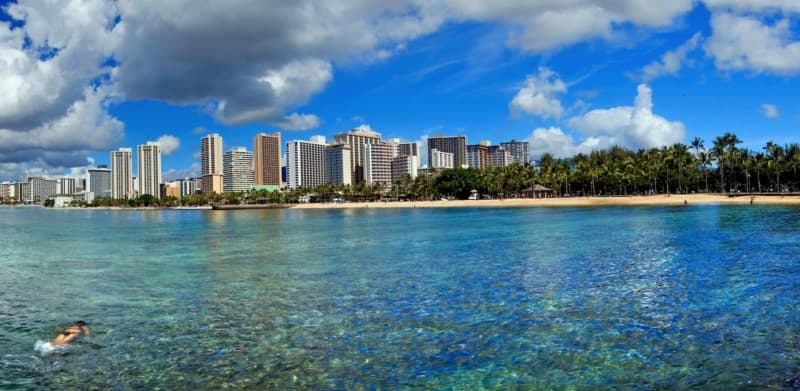 Person snorkeling in the waters of the Waikīkī Marine Life Conservation District between Queen's and Sans Souci Beach